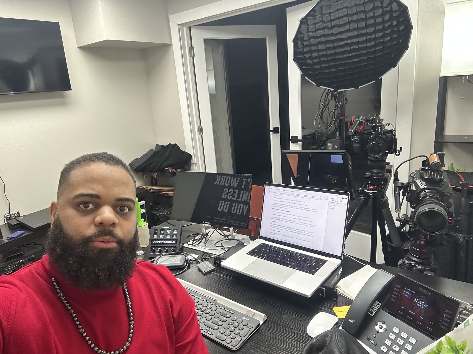 Aarius Dumas at his edit station with cameras, lighting and a color-managed workstation