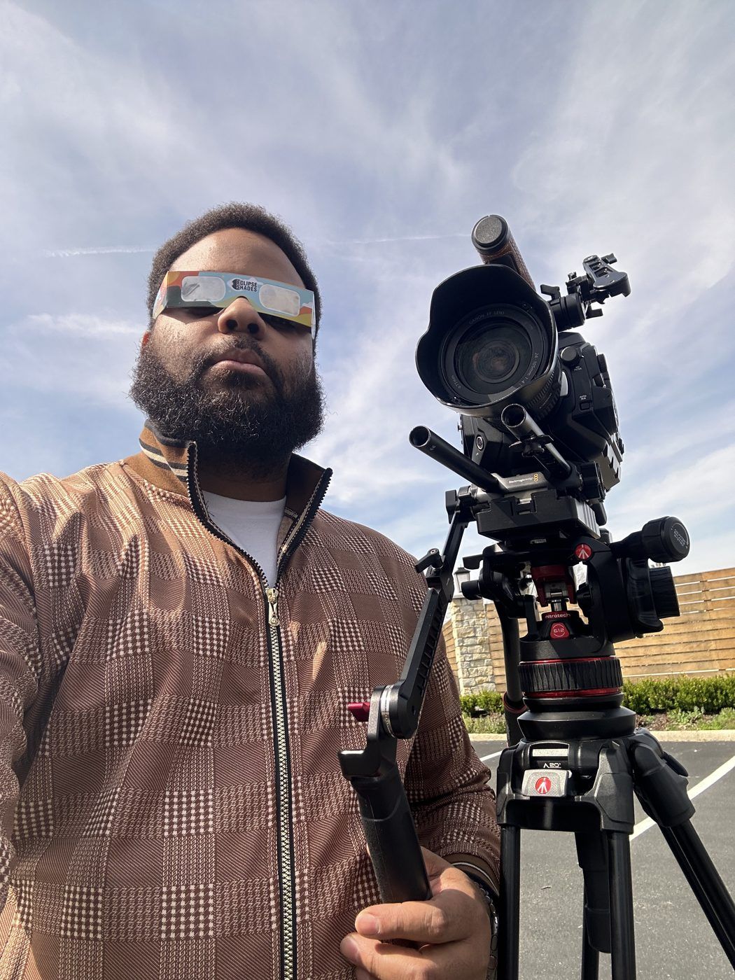 Aarius Dumas behind a cinema camera in the field